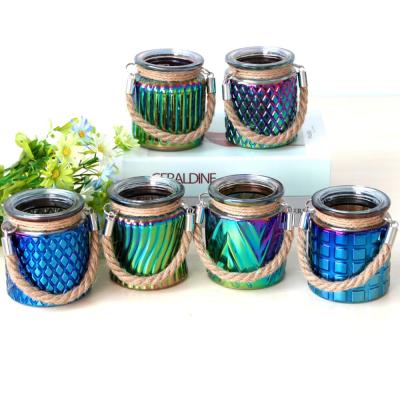 China Eco-friendly Colorful Unique Shaped Hanging Glass Candle Jar Holder Candle Lantern With Hemp Rope Handle for sale