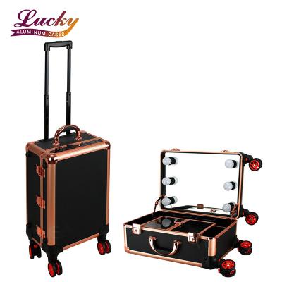 China Durable Portable Travel Makeup Studio Rolling Case with 6 LED Lights and Mirror Cosmetic Case with Rose Gold Wheels for sale