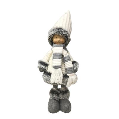 China Cartoon Toy Home Ornament Christmas Knitted Cloth Dolls Holding Boy With Woolen Scarf And Hat for sale