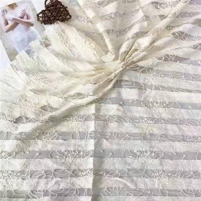 China 2022 Breathable Wholesale Newest Design Flower Embroidered Fabric On Net Cloth Fabric With Cotton Stripes for sale