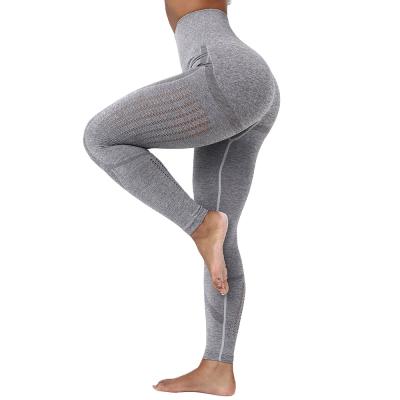 China Solid Color Breathable Seamless Yoga Pants Hip Peach Women's High Waist Cavity Quick Dry Pants Tight Fitness Pants for sale