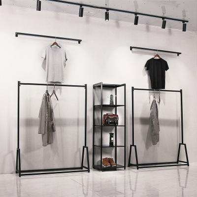 China Modern simple single-sided iron clothes rack gold Floor-standing clothing store use shelf unisex wall hanging display rack for sale