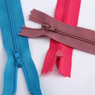 China Fashion logo long chain #3 #5 #8 nylon protective zipper wholesale custom made eco-friendly zipper puller for garment for sale