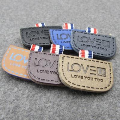 China Durable Patch Label PU Leather Label Jeans Leather Garment Labels for sale