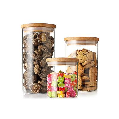 China Wholesale cheap cover price glass food storage jar with wooden lid glass jam bottles for kitchen for sale