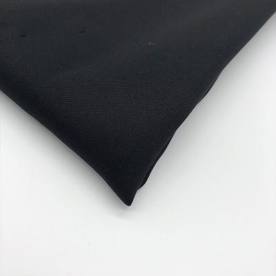 China Custom Color Dark Black Memory Yarn Dyed Woven Polyester Fabric Stretch For Garments for sale