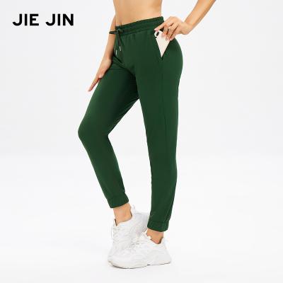 China Breathable Sporty Jogger Yoga Jogger Women's Lounge Drawstring Working Pants Loose Waist With Pockets for sale