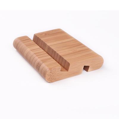 China 2pcs Natural Stylish Universal iPhone Phone Stand China Portable Bamboo Wood Mobile Phone Stand for sale