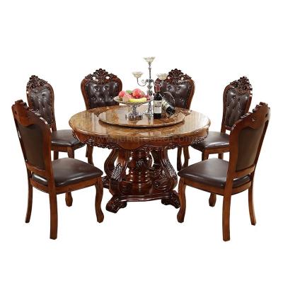 China Masterpiece Hand Carved Wood Dining Set Domestic Round Dining Table With Chair Factory Price Delicate Brown Dinner Table for sale