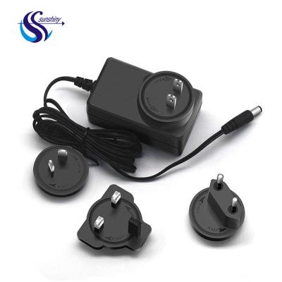 China UniversalÂ   International Interchangeable AC Adapter Plugs Power Adapter 5v 15w Wall Change Charger For Mobile Phone for sale