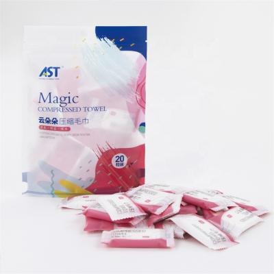 China Compressed Disposable Biodegradable Magic Coin Compressed Napkin With Candy Packet for sale