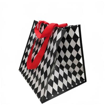 China Reusable inner and outer laminated pp woven durable shopping bag with eyelets for sale