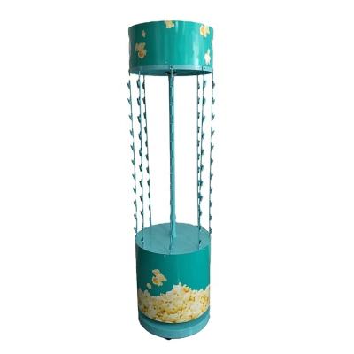 China Deploying Snack Promotion Floor Metal Unique Design Clip Snacks Show Rotating Rack / Custom Popcorn Free Standing With Logo Wheels Removable for sale