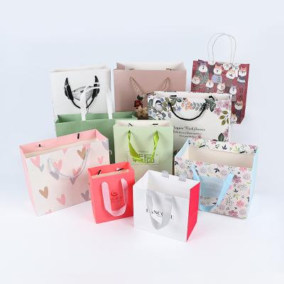 China Biodegradable Custom Printed Your Own Logo White Brown Kraft Gift Craft Shopping Paper Bag With Handles en venta