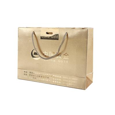 Cina Biodegradable Luxury Matte Gold Logo Printed Shopping Paper Bag With Rope Handles For Jewelry Packaging in vendita