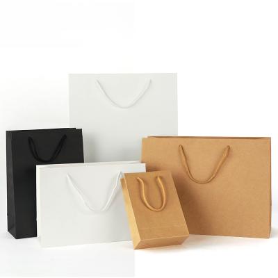 China Custom Logo Print Brand Brown Black Wholesale Biodegradable Cheap White Craft Kraft Paper Manufacturer Gift Shopping Packaging Paper Bag With Handle en venta