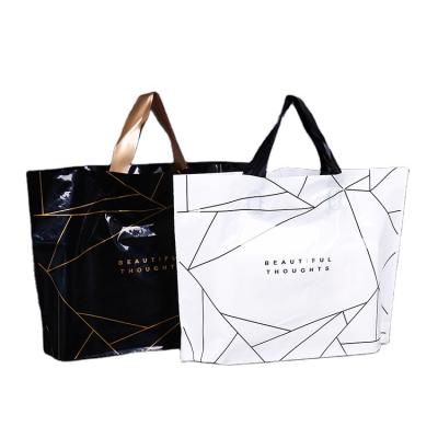 Cina PE webshop clothing package moisture proof custom black plastic carry bags custom logo printing shopping plastic bags with handles in vendita