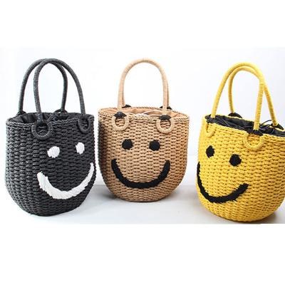 China Fashion Wholesale Casual Basket Women Beach Handbag Cute Embroidered Smiley Face Pattern Straw Bags for sale