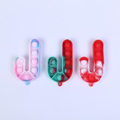 China Relieve Stress Christmas Series Candy Silicone Pressure Silicone Key Chain Children's Single Finger Restless Toys for sale