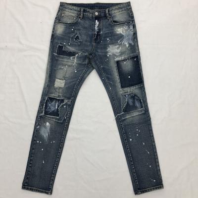 China Distressed Blue Slim Fit Unique Paint Distressed Men's Patchwork Stretch Color Fade Proof Wash Jeans High Quality Splatter Faded Faded for sale