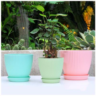 China Modern manufacturers directly for Amazon hot vertical stripe round mouth with pot trailer family gardening desktop plastic flower pot for sale