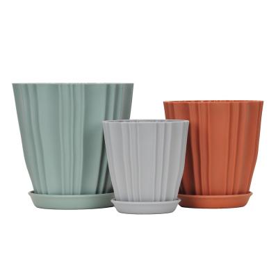 China Modern direct hot sale simple style factory supply indoor green plant suit with pot drag stripe open plastic flower pot for sale