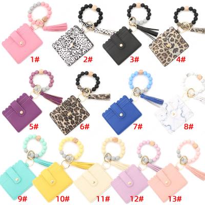 China 2021 Keychain Anti-theft PU Leather Wristband Card Holder Keychain Tassel Wristband Card Holder Keychain Key Chain Wallet 2021 for Women for sale