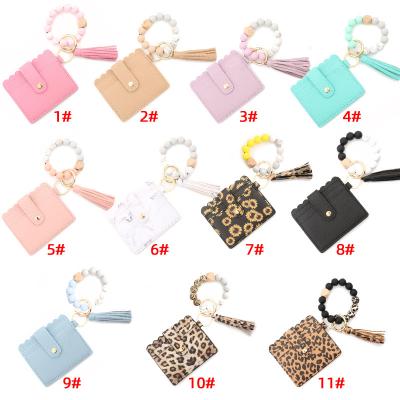 China 2021 Keychain Anti-theft PU Leather Wristband Card Holder Keychain Tassel Wristband Card Holder Keychain Key Chain Wallet 2021 for Women for sale