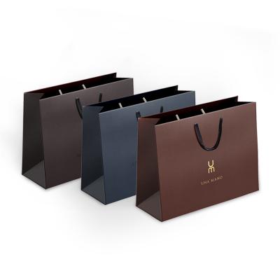 China Custom FSC Logo Luxury Shopping Gift Packaging Apparel Paper Bag Clothes Shoes Packaging Paper Tote Bag for sale