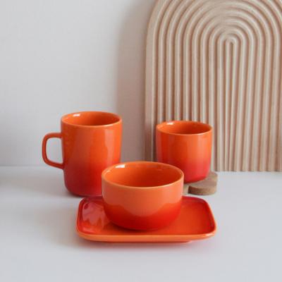 China Viable Custom Ceramic Orange Color Glaze Dinnerware Cup Dish Bowl Personalized Dinnerware Set for sale