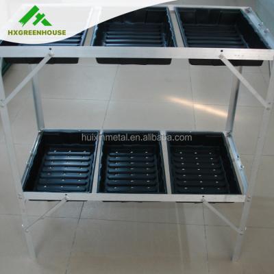 China Modern freestanding and carry-house display greenhouse with seed trays shelves for sale