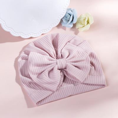 China New COMMON Fashion Kid Beanie Keep Warm Baby Boy Cotton Solid Color Bow Hat Winter Warm Hat for sale