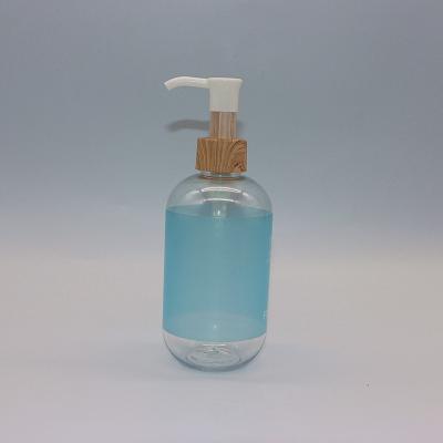 China Empty Pet 300ml Stock Cosmetic Bottle With Pump Bamboo Hand Liquid Soap Bottle With Bamboo Pump Shampoo Bottles for sale