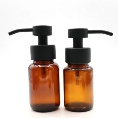 China Eco-friendly Recyclable 100ml 120ml Amber Glass Foaming Soap Pump Bottle With Stainless Steel Foaming Pump for sale