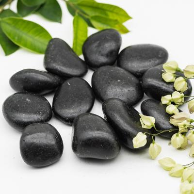 China Modern Landscaping Garden Pathways River Black Pebble Stone Decoration for sale