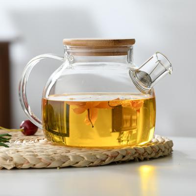 China Viable Glass Kettle Water Jug Pyrex Borosilicate Glass Teapot With Bamboo Lid for sale