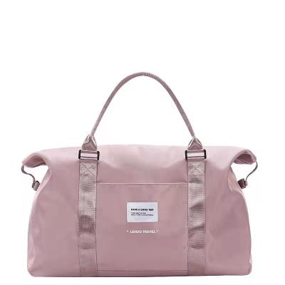 China Multificational/Lightweight Luggage Bags Female Pink Waterproof Canvas Luggage Bag Waterproof Large Capacity for sale