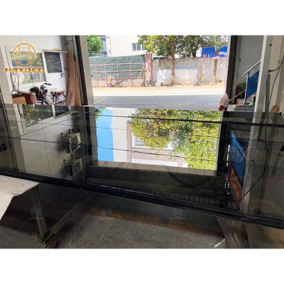 China Mirror Tempered Glass Garage Windproof Door Customized Commercial Residential Automatic Rolling Garage Glass Aluminum Sectional Door for sale