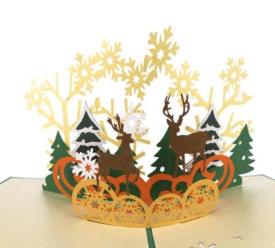 China Europe Customized Design Forest And Elk 3D Pop Up Christmas Cards With LED Light for sale