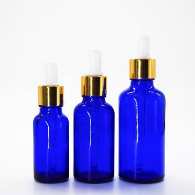 China 5ml 10ml 15ml 20ml 30ml 50ml 100ml blue green glass cosmetic essential oil dropper bottle for sale