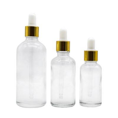 China Wholesale clear essential oil skin care glass dropper bottle 5ml10ml15ml20ml 30ml50ml100ml with golden ring for sale