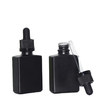 China Rectangular Matte Black Essential Oil Bottle 30ml Square Glass Dropper Bottle Essence Bottle for sale