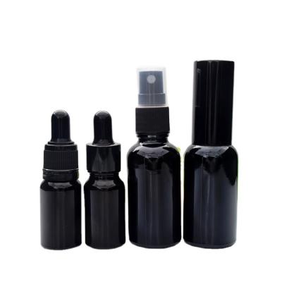 China Factory wholesale black essential oil bottle 10ml15ml20ml30ml50ml100ml glass dropper bottle for sale