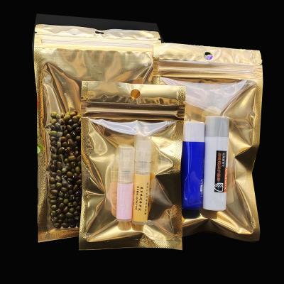 China Recyclable in Stock Clear Front Silver Gold Golden Back Laminated Multiple Layer Aluminum Foil Bag Zip Lock Plastic Mylar Bag for sale