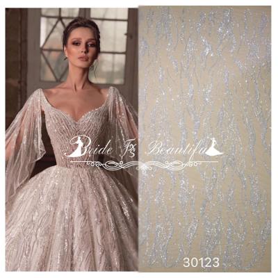 China Crystal Sequins Bridal Luxury Embroidery Viable Beads White Beaded Wedding Tulle Lace Fabric for sale