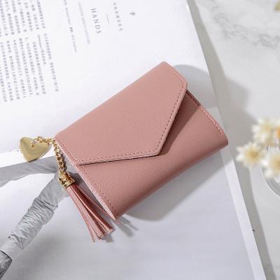 China New hand fashion heart fashion short simple fashion pendant multifunctional pattern women's lychee purse for sale