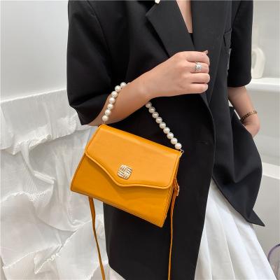 China Fashoion Pure Color Bucket With Pearl Handle Shoulder Messenger Bag Women Round Messenger Bags Women New for sale