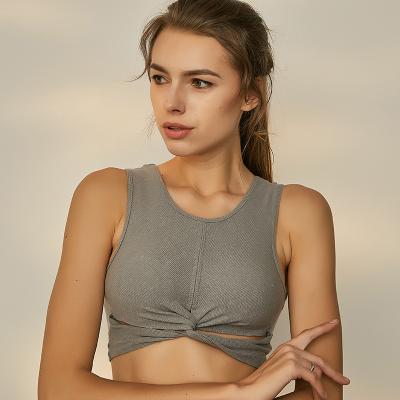 China Women 2022 New Breathable Sports Bra Fashionable High Elastic Fitness Running Clothing Top Ribbed Cross Tie Yoga Bra for sale