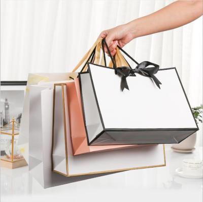 China Recycled Packaging Materials Tissue Bag Kraft Paper White Gift Bags Gift Gift Box Packaging Large Shopping Bag With Ribbon for sale