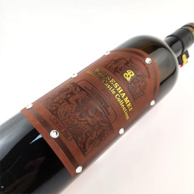 China OEM Marca Estampado Etiqueta de cuero de PU Etiqueta personalizada de vino etiquetas de cuero personalizadas pegatina en venta